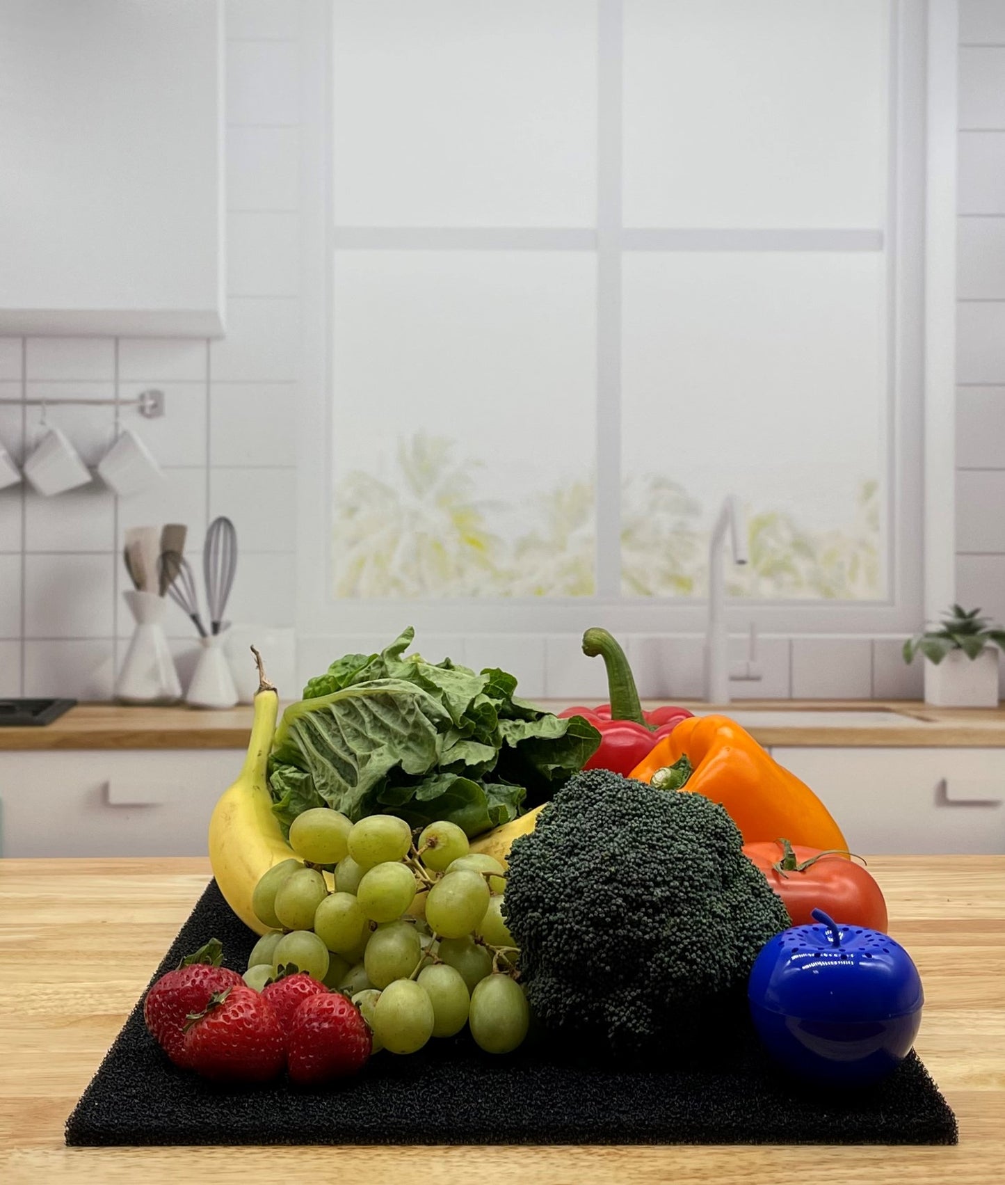 Produce on Black FreshMat in kitchen with Bluapple