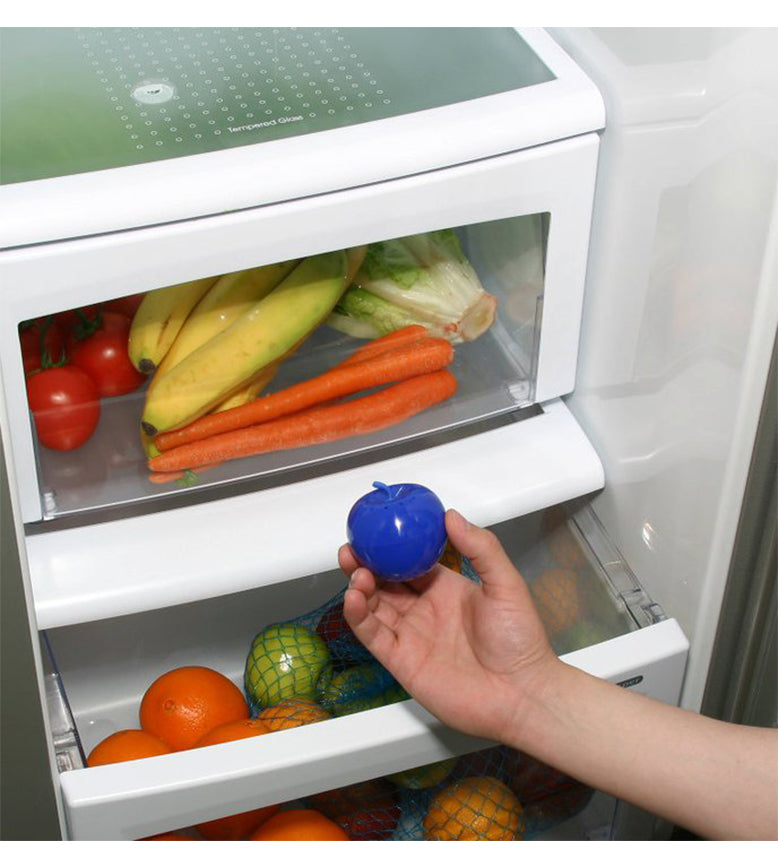 Bluapple being held over a crisper drawer