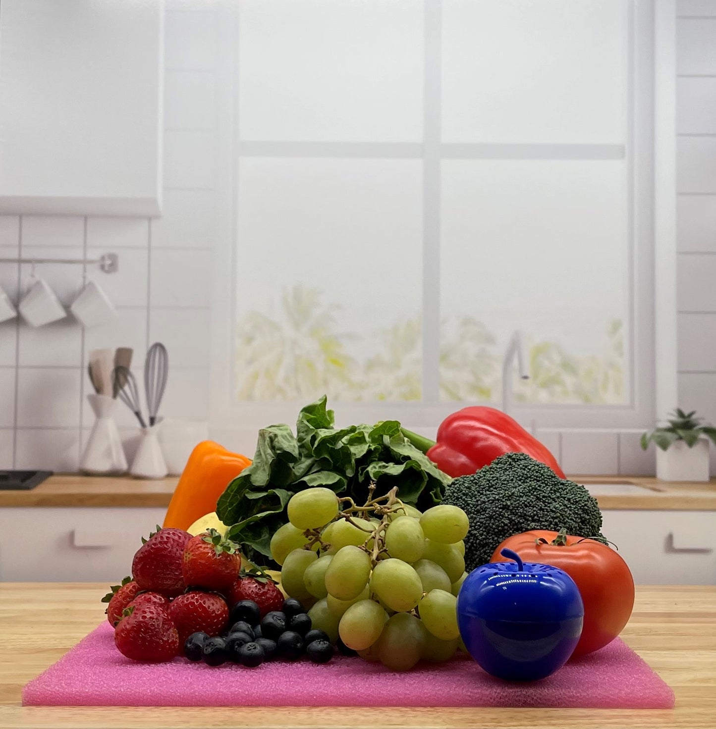 Produce on Pink FreshMat in kitchen with Bluapple
