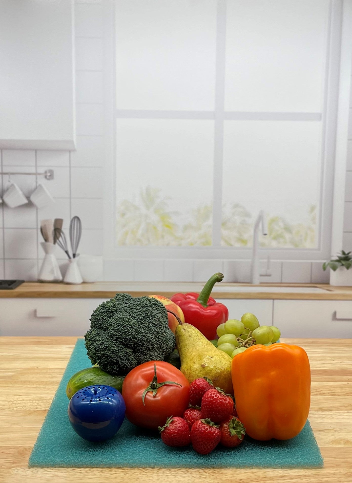 Produce on Teal FreshMat in kitchen with Bluapple