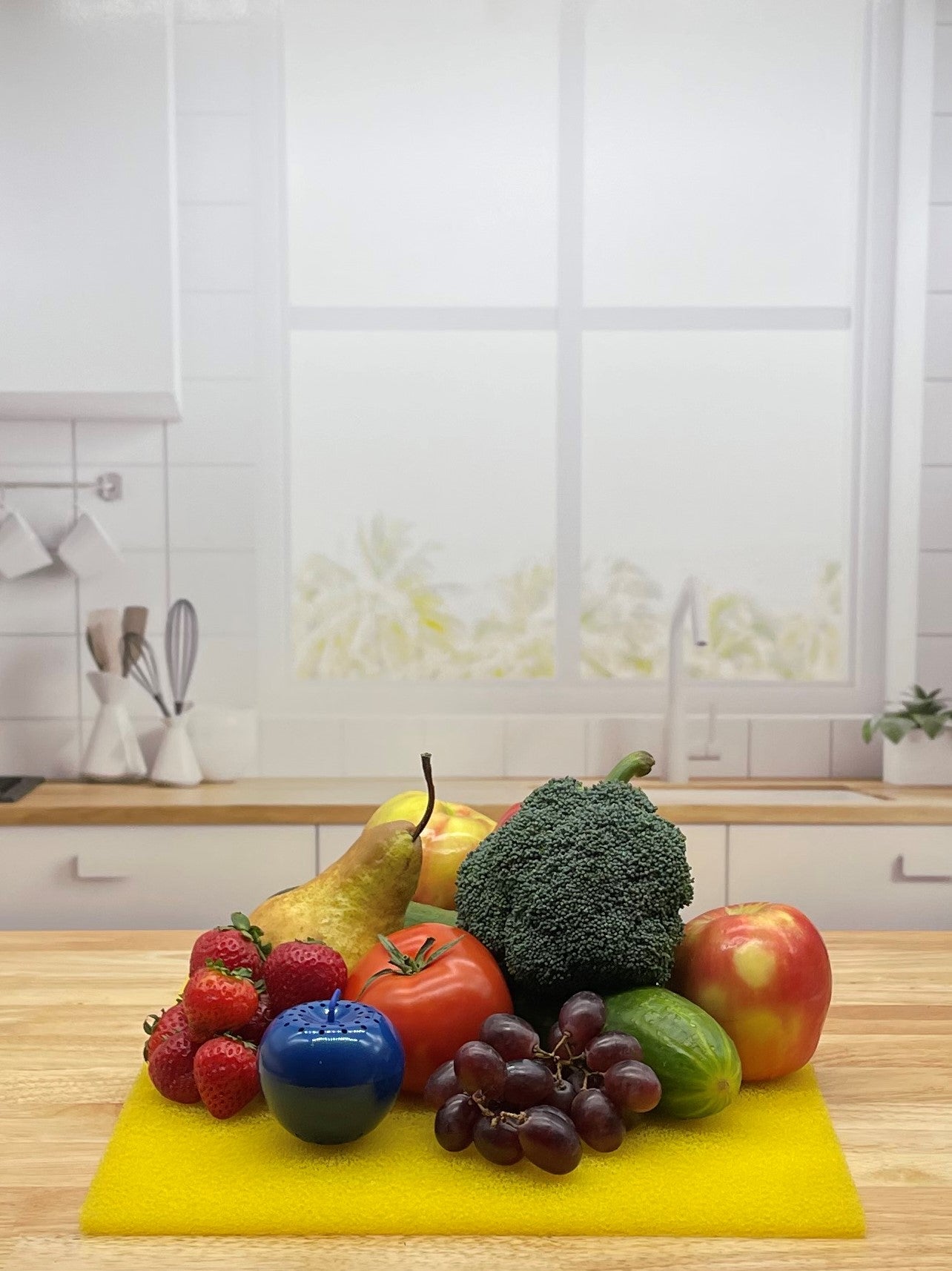 Produce on Yellow FreshMat in kitchen with Bluapple